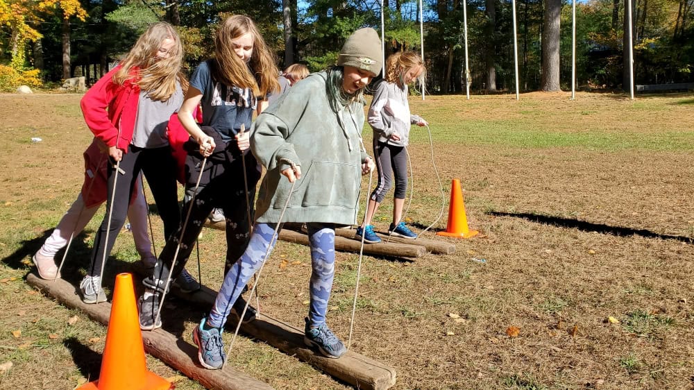 Outdoor team building activity with children at Narragansett Council camp.