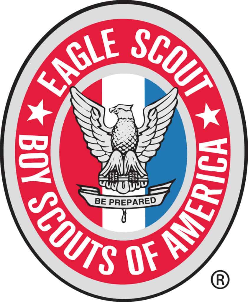 Eagle Scout badge featuring an eagle with outstretched wings and the motto "Be Prepared.".