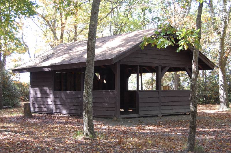 Rustic wooden shelter at Camp Aquapaug in Narragansett Council.