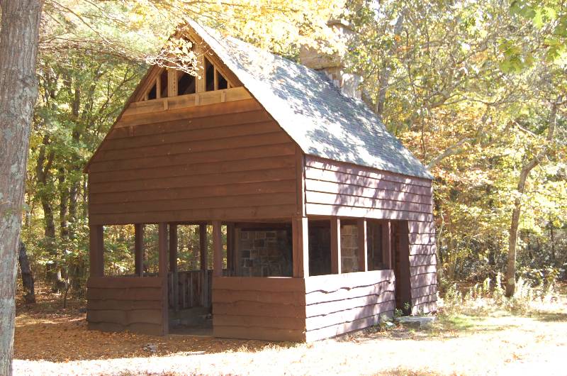 Wooden cabin at Camp Aquapaug, ideal for Scout activities and outdoor adventures.