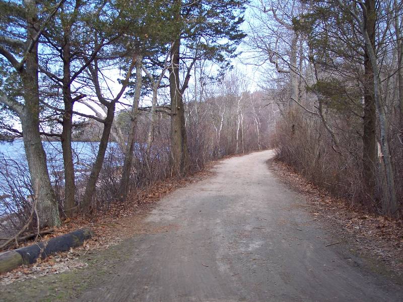 Scenic trail at Camp Aquapaug in Narragansett Council, featuring wooded paths and natural beauty.