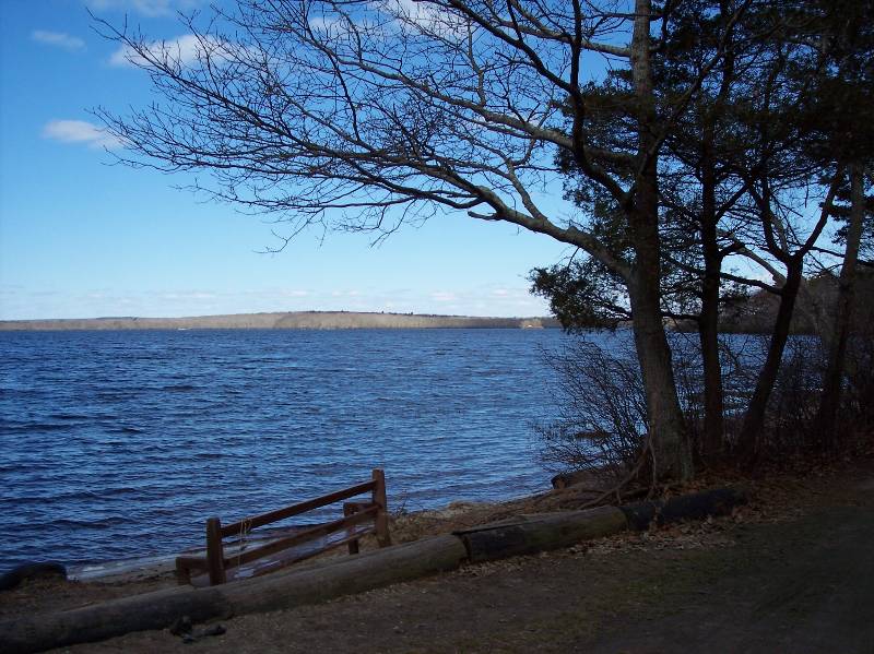 Beautiful view of Lake at Camp Aquapaug with trees and shoreline.