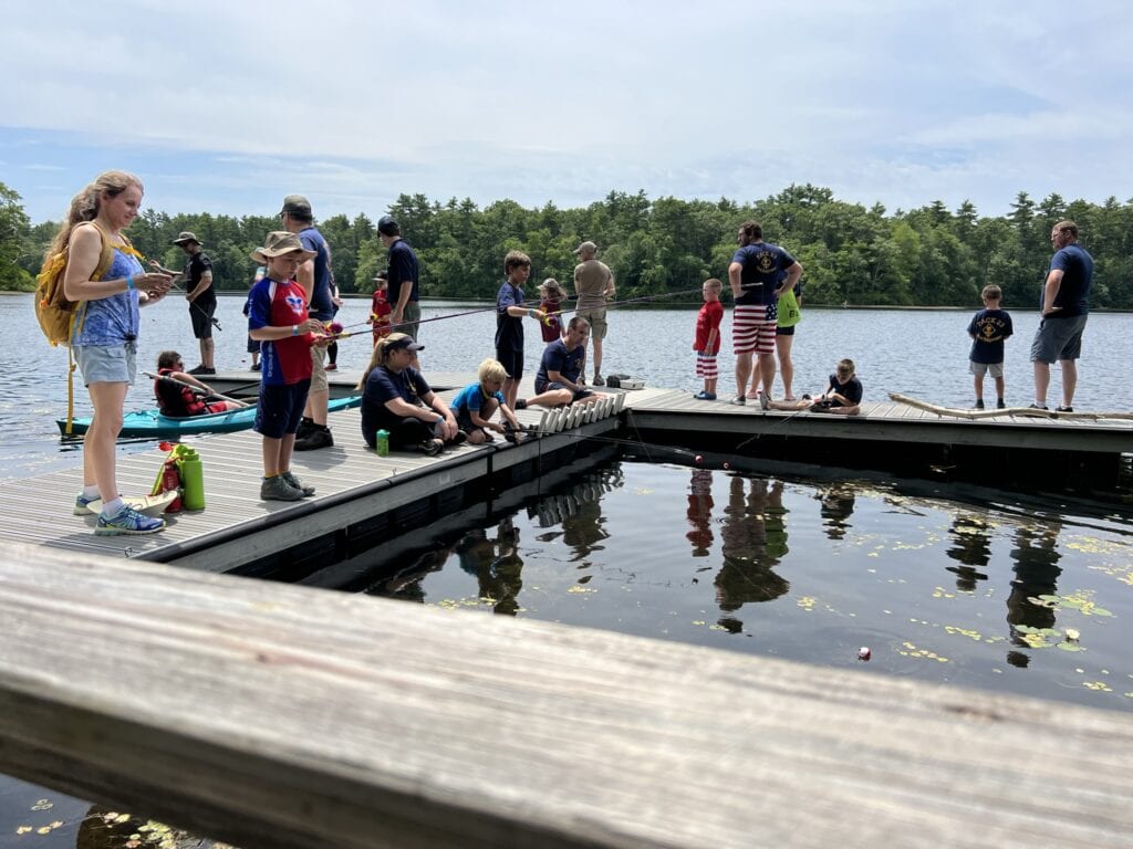 Cub Scouts fishing at Camp Norse during a Cub Together Weekend