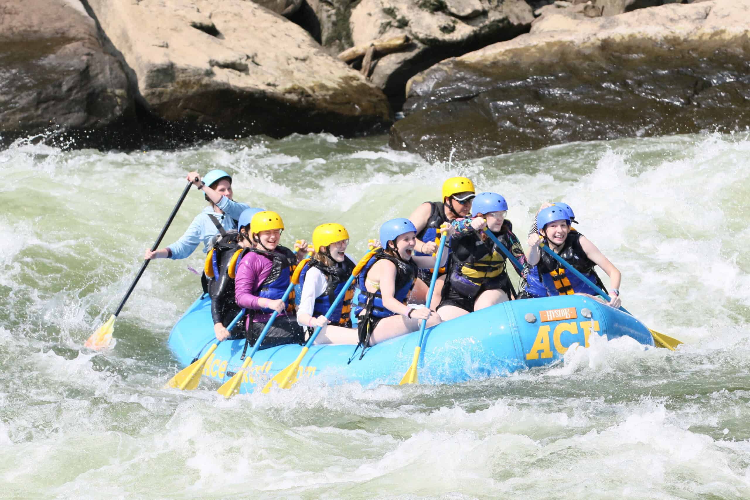 Rafting on the whitewater river during Camp Yawgoog at Narragansett Council.