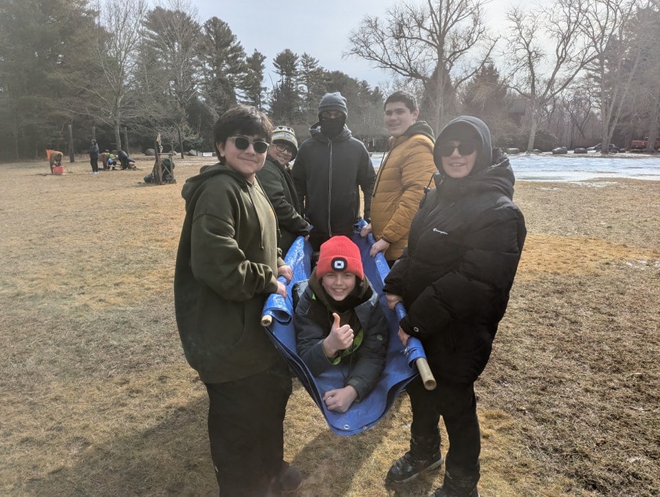 A team of Scouts working together at a Klondike Derby station
